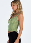 Green top Lace material Square neckline Hook and eye fastening at front Good stretch Mesh lining