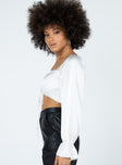 side view of model wearing Princess Polly Jolie Long Sleeve Top White 