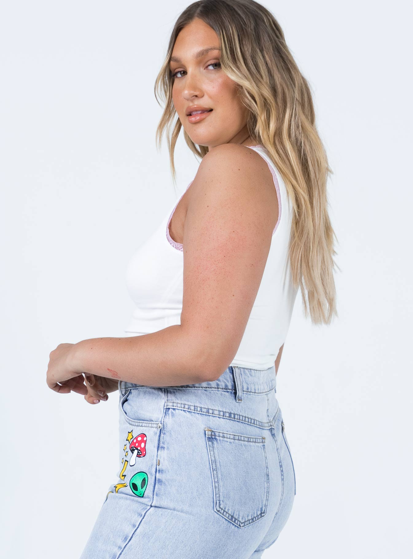 side view of model wearing Princess Polly Nostalgia Graphic Top White 