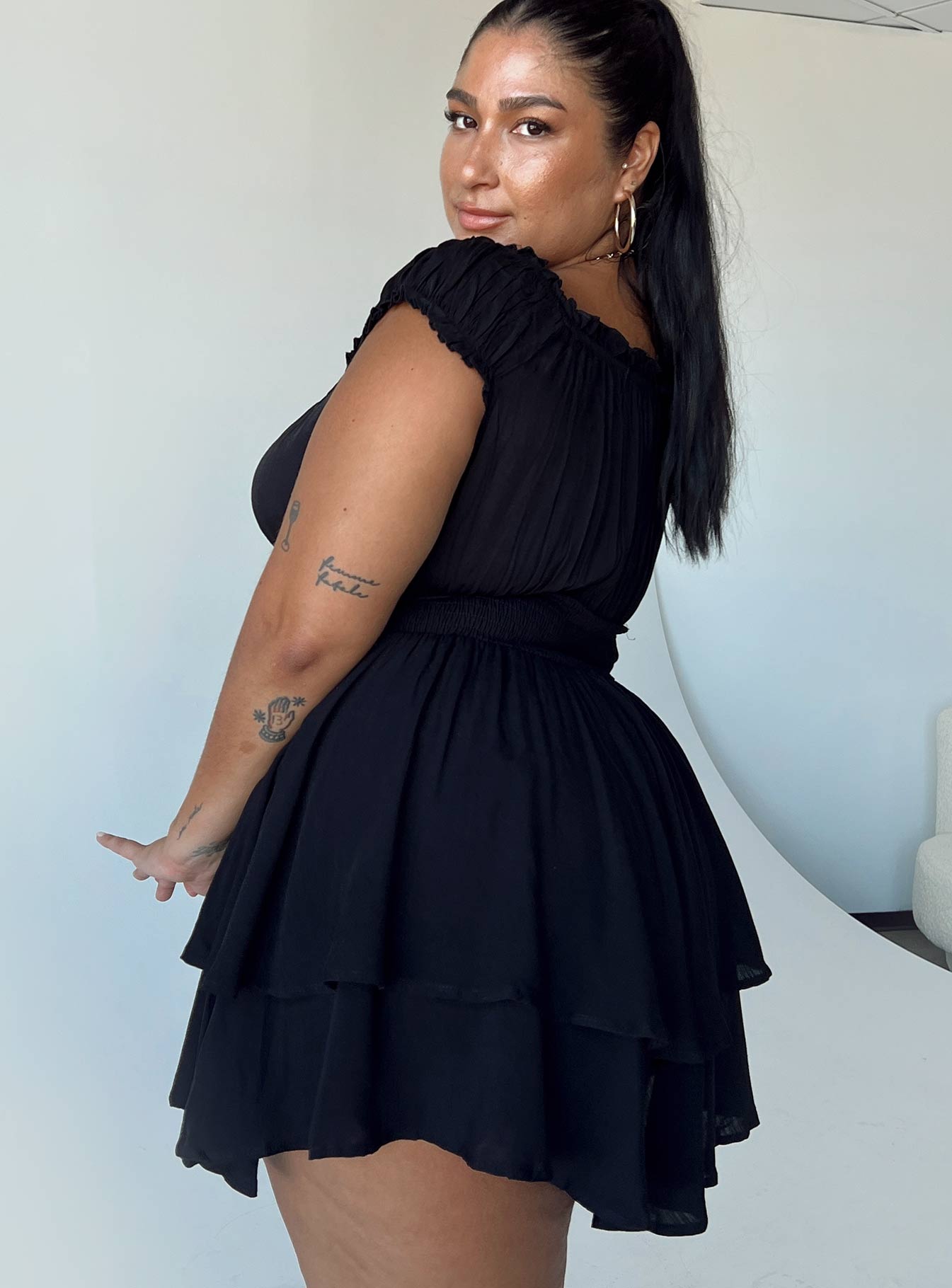 Romper Elasticated shoulders & neckline  Can be worn on or off the shoulder  Gathered bust  Boning through waist  Shirred back panel  Layered bottom 