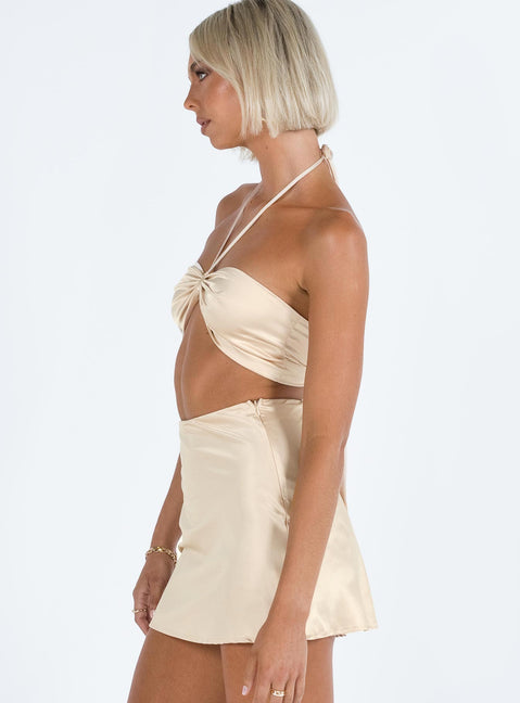 Two piece set Silky material Halter neck crop top Back tie fastening High waisted mini skirt Invisible zip fastening at side