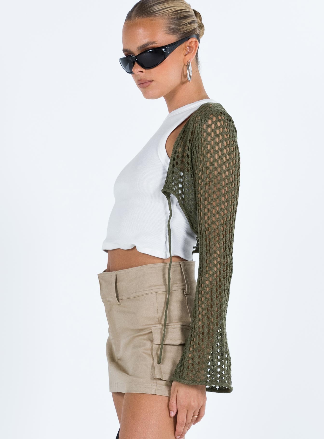 side view of model wearing Princess Polly Savi Long Sleeve Cardigan Green Cropped 