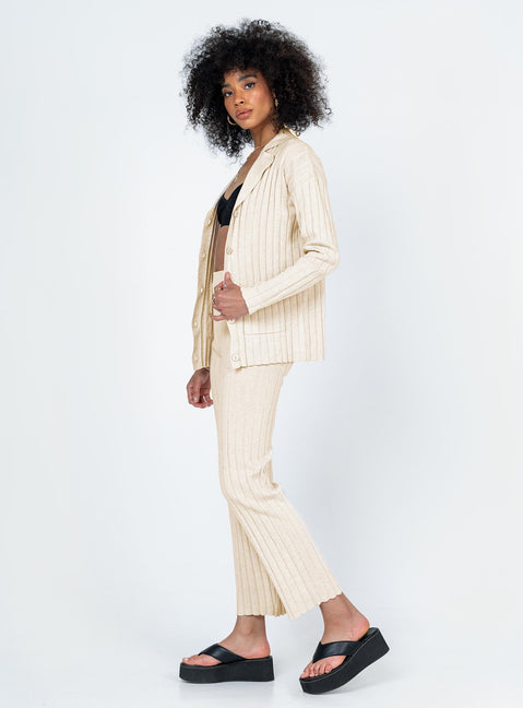 Matching set  Relaxed fit Princess Polly Exclusive 63% recycled polyester 25% polyester 12% nylon Heavy wide ribbed material  Long sleeve button up top   Twin front pockets  High waisted pants  Elasticated waistband Slim leg  Raw-edge hem 