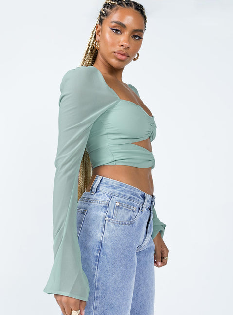 side view of model wearing Princess Polly Dumont Long Sleeve Top Blue Full Sleeves Square Neck 