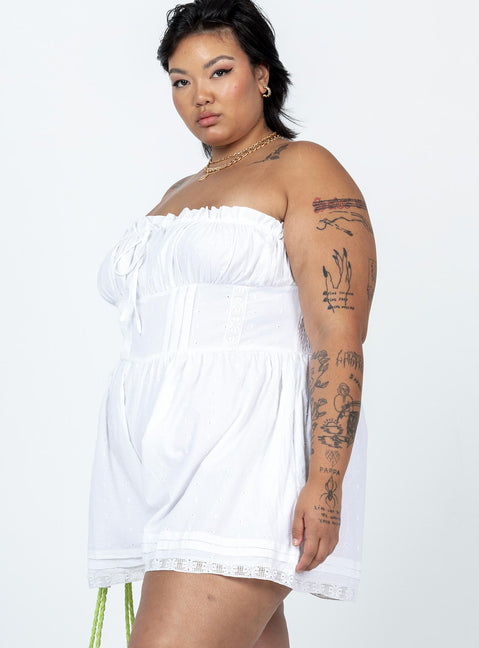 Strapless romper Lace details Ruffle neckline  Adjustable tie at neckline  Shirred back  Twin hip pockets  Non-stretch