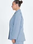 Blue blazer Lapel collar Button fastening at front Shoulder pads Faux hip pockets Split at back