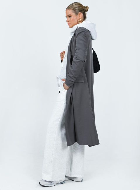 Trench coat Lapel collar Twin hip pockets Split at back
