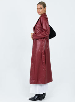 Long coat Faux leather material Lapel collar Removable waist tie Belt loops at waist Twin hip pockets Split hem at back