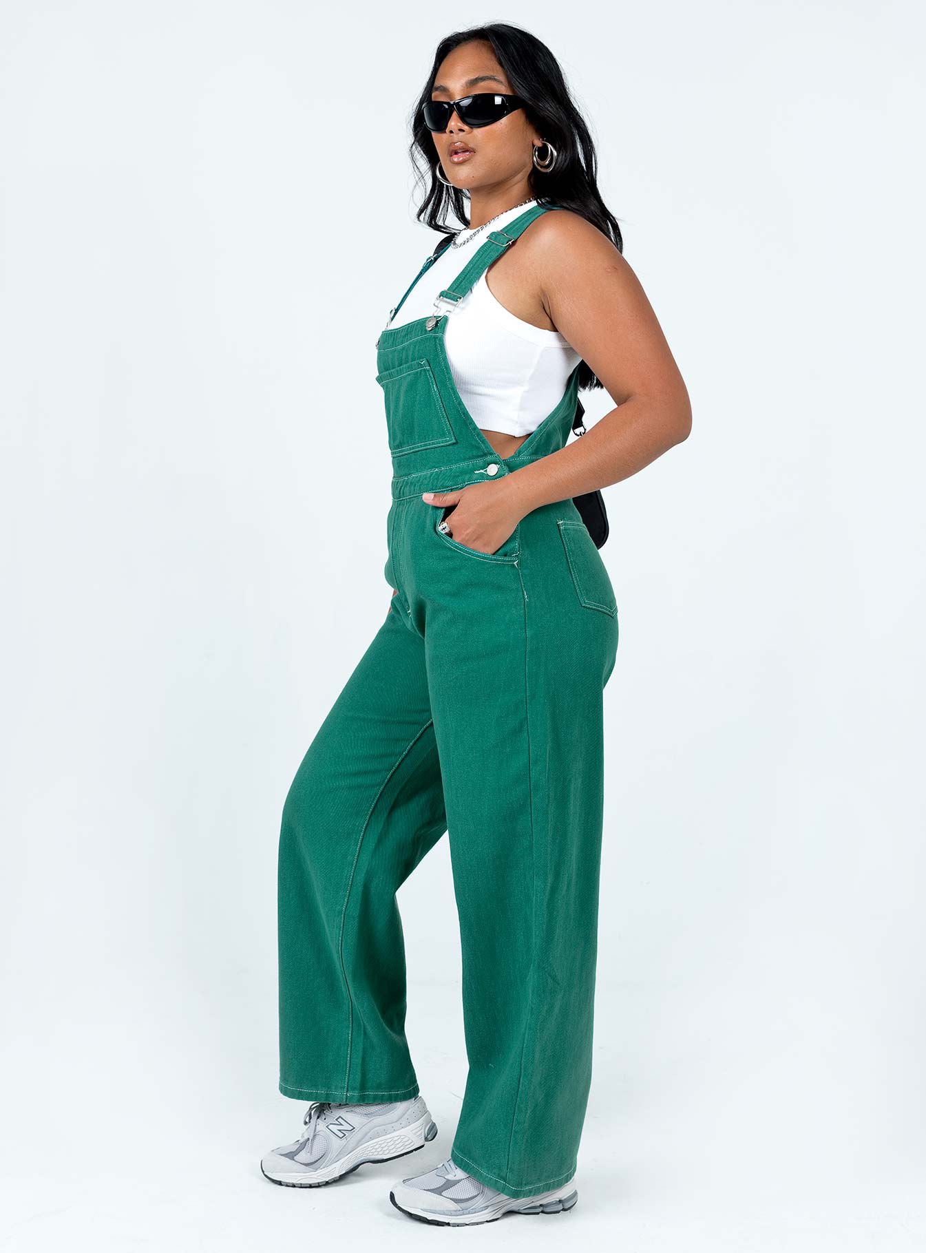 Green overalls Contrast stitching Adjustable shoulder straps  Large chest pocket  Four classic pockets  Button fastening at hips  Wide leg