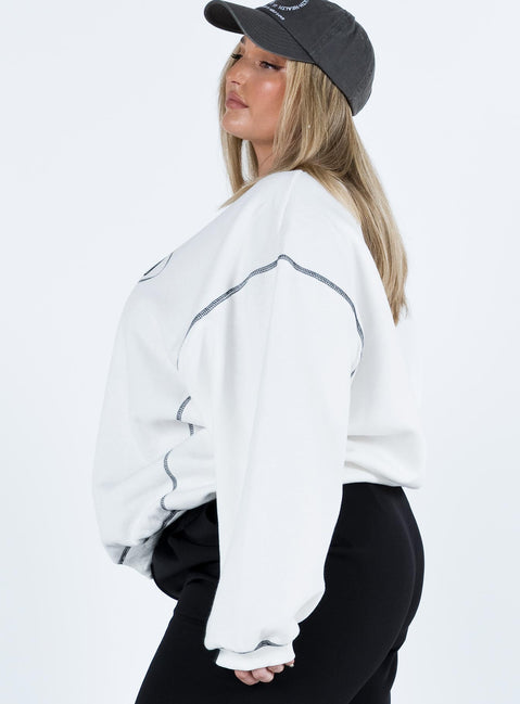 side view of model wearing Princess Polly Portland Oversized Sweatshirt White Curve regular 