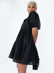 side view of model wearing Princess Polly Braxton Mini Dress Black V-Neck 