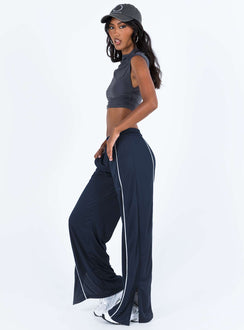 Front view of model wearing  front Princess Polly High Waisted Pants  Motel Shobi Jogger Navy