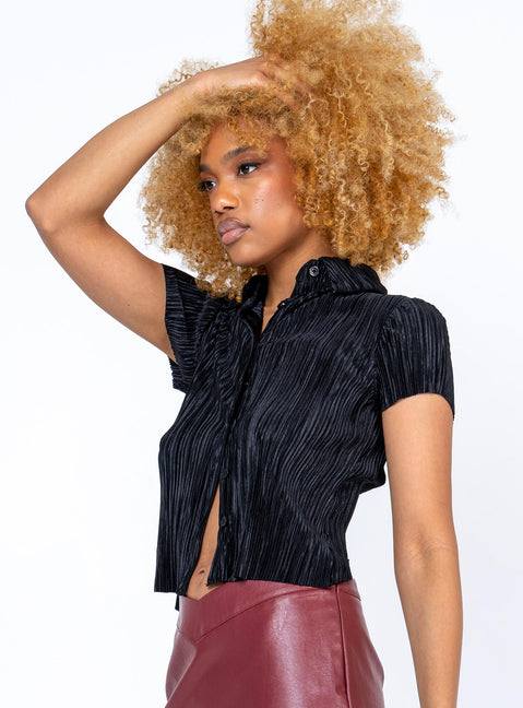 side view of model wearing Princess Polly Akira Shirt Black Short Sleeves V-Neck 