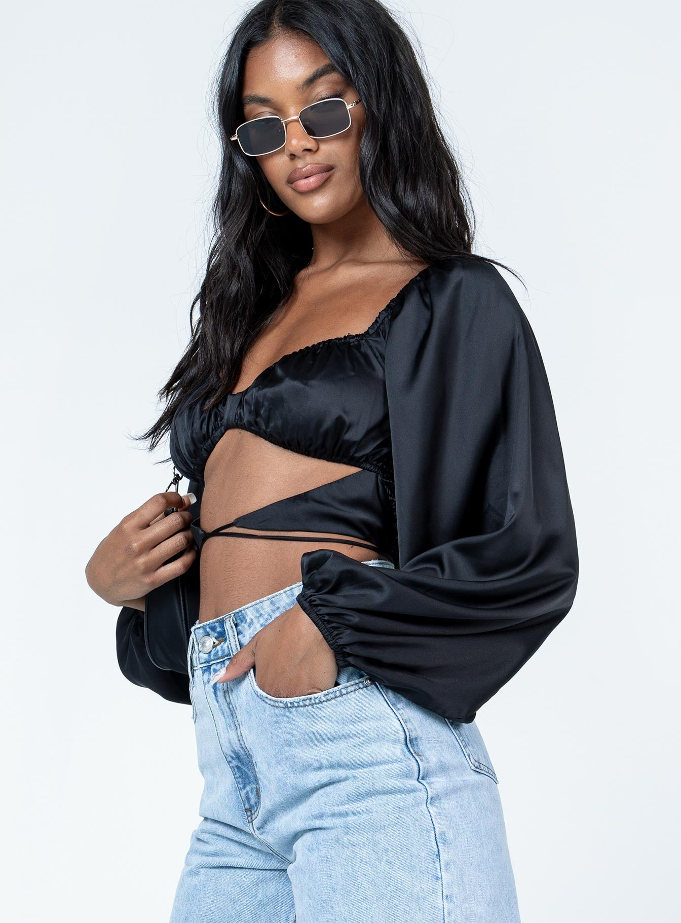 side view of model wearing Princess Polly Nikita Long Sleeve Top Black Full Sleeves Sweetheart 