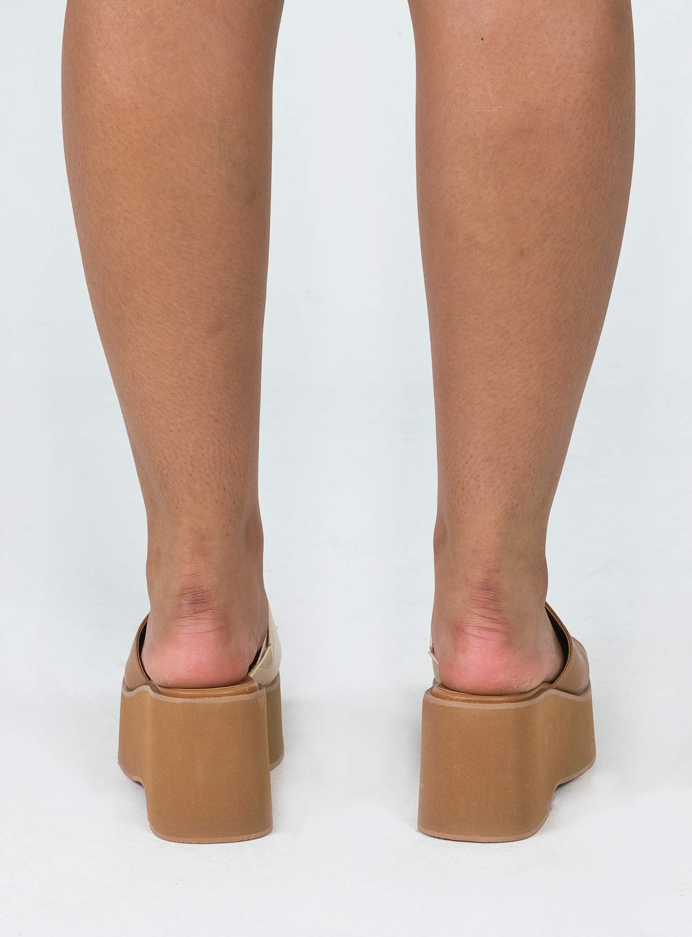 Sandals Upper 100% PU Lining 100% PU Outsole 100% rubber Single faux leather upper Yin & yang print Elasticated slit on upper  Padded foot bed  Square toe Slip on style