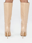 Boots Faux croc leather  Knee-high  Stilleto style heel Pointed toe  Padded inside  Exposed zip on inner side 