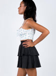   side view of model wearing Princess Polly Greta Mini Skirt Black 