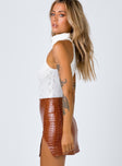   side view of model wearing Princess Polly The Wren Mini Skirt Brown Croc 