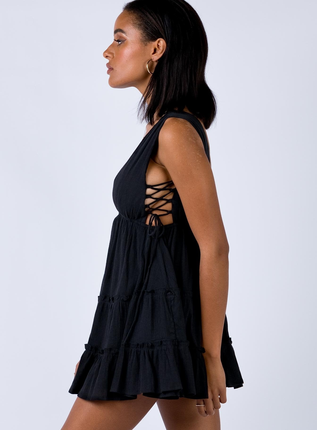 side view of model wearing Princess Polly Krissa Mini Dress Black 