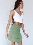   side view of model wearing Princess Polly Lillie Mini Skirt Green 