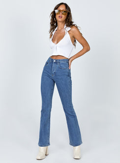 side view of model wearing Princess Polly Dark Wash Flare Jean Denim High Waisted 