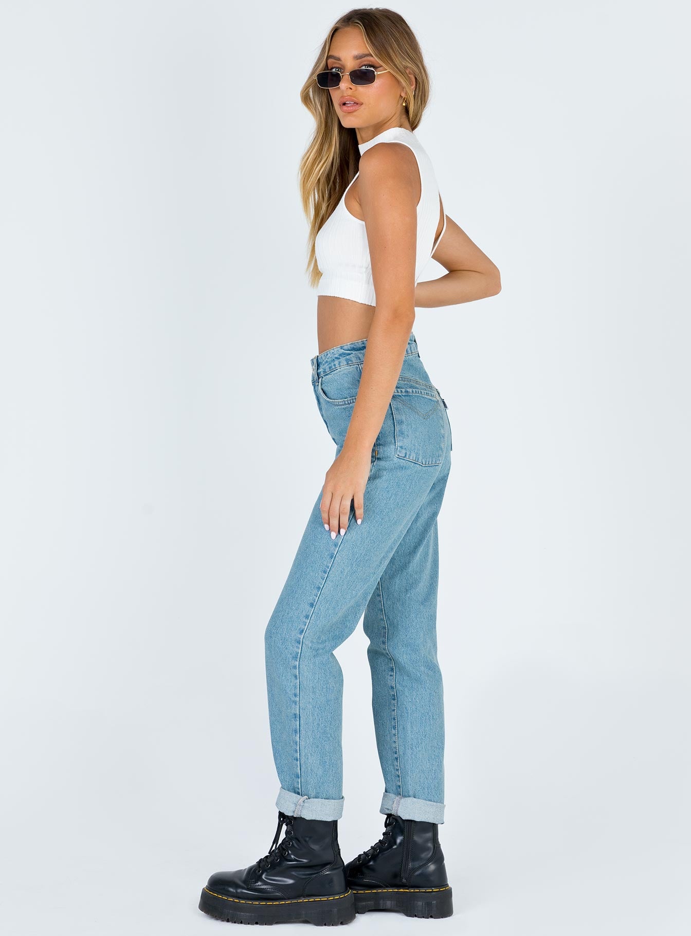 side view of model wearing Princess Polly Ragged Priest Cougar Jean Mid Rise 