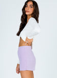   side view of model wearing Princess Polly Selby Mini Skirt Lilac 