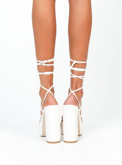 White heels Faux leather material  Strappy upper  Ankle tie fastening  Platform base  Block heel  Square toe 