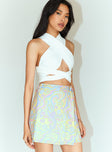   side view of model wearing Princess Polly Retro Swirl Wrap Mini Skirt 