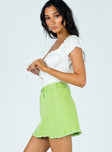   side view of model wearing Princess Polly Jessika Mini Skirt Green 