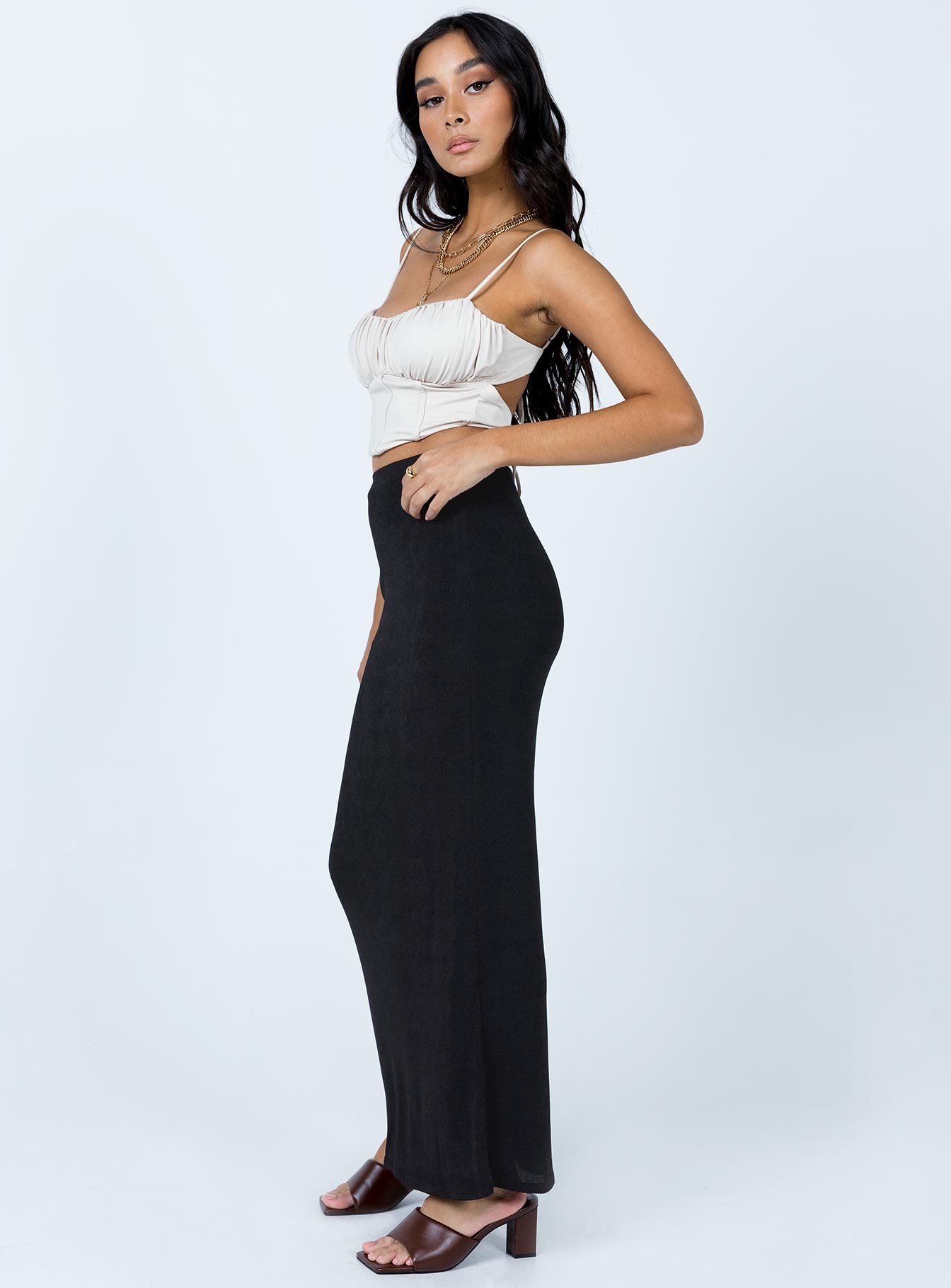   side view of model wearing Princess Polly Harriette Maxi Skirt Black 