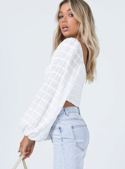side view of model wearing Princess Polly Riley Long Sleeve Top White 