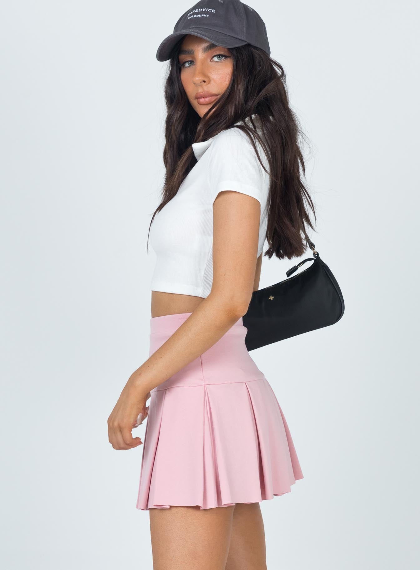   side view of model wearing Princess Polly Rescue Me Pleat Skirt Pink 
