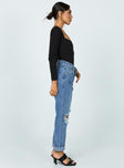 side view of model wearing Princess Polly Hayden Knee Rip Jeans Mid Wash Denim High Waisted 