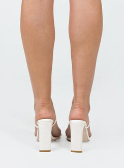 Heels Faux leather Thin double strap upper  Square toe  Shaved block heel Padded footbed 