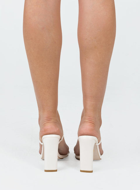 Heels Faux leather Thin double strap upper  Square toe  Shaved block heel Padded footbed 