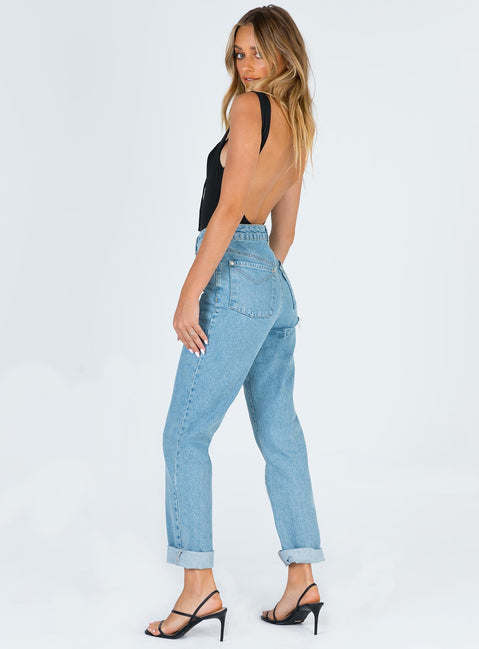 back view of model wearing Princess Polly Ragged Priest Butt Cut Jean Light Blue Mid Rise 