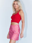   side view of model wearing Princess Polly The Joan Checkerboard Mini Skirt Pink 