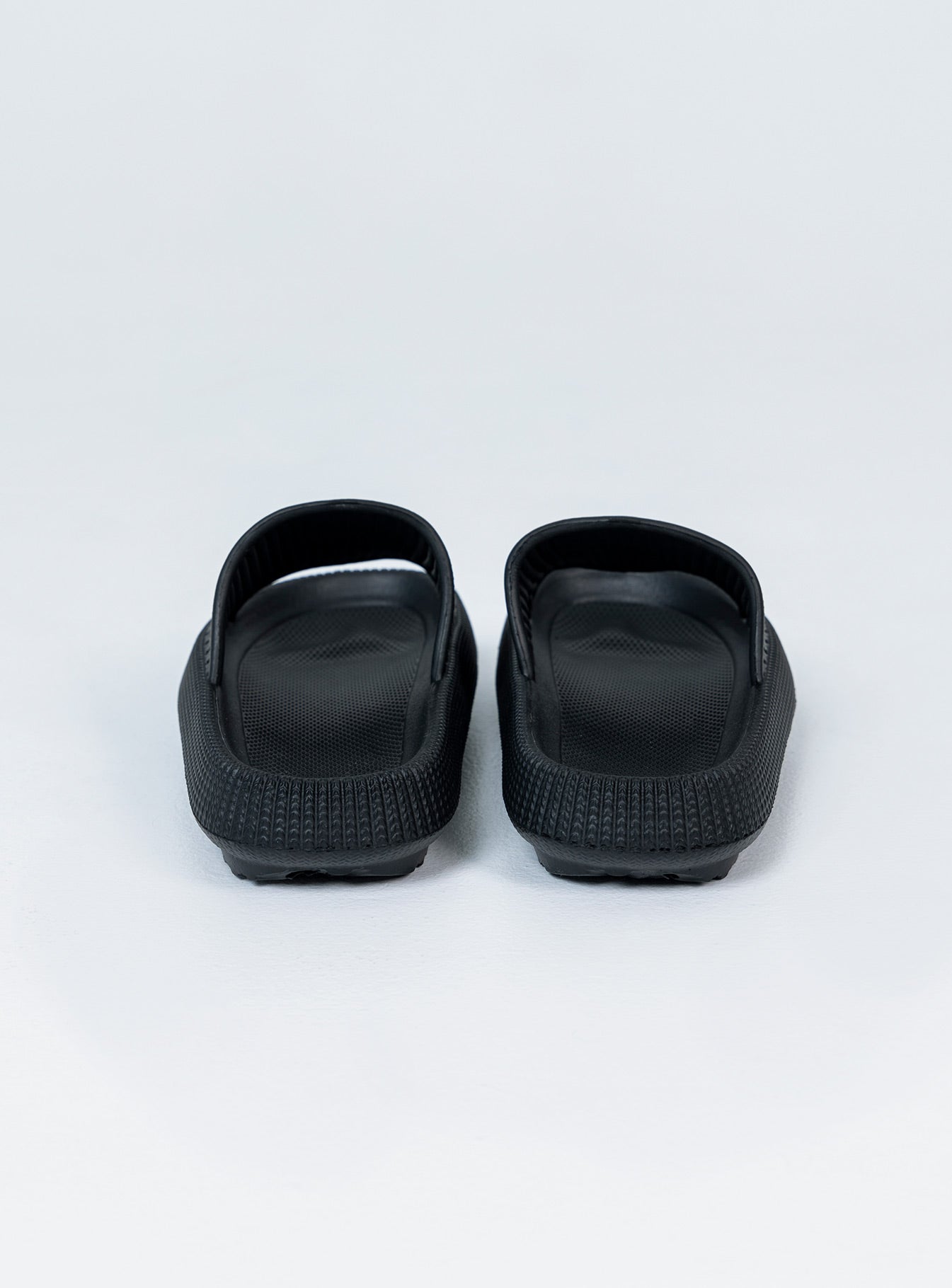 Slides 100% EVA Lightweight rubber  Single wide upper  Rounded toe 