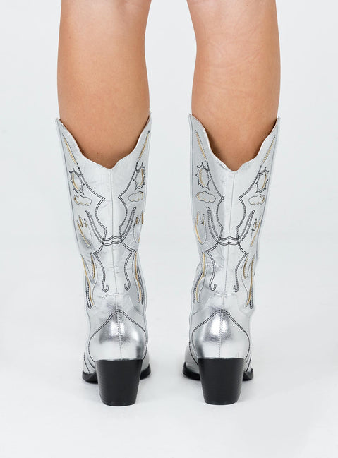 Cowgirl boots  Princess Polly Exclusive Upper 100% PU  Lining & insock 100% textile  Outsole 100% TPU  Metallic material Mid-calf length  Rounded hem  Pointed toe  Detail stitching 