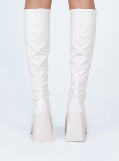 Boots  Faux leather material  Fitted at leg  Block heel Platform base  Square toe  Good stretch 