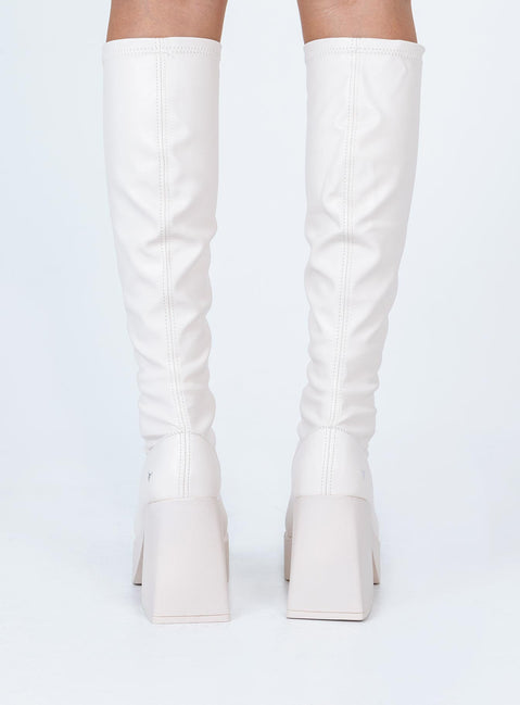 Boots  Faux leather material  Fitted at leg  Block heel Platform base  Square toe  Good stretch 