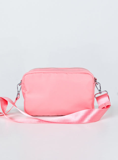Crossbody bag  Princess Polly Exclusive   60% recycled nylon 40% nylon Nylon material Two external pockets  Zip fastening  Crossbody strap 