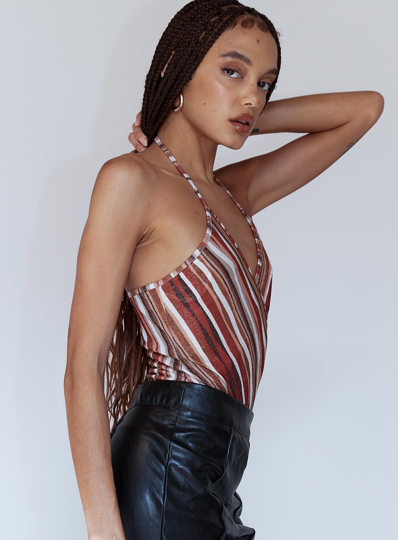 side view of model wearing Princess Polly Quinn Bodysuit Orange Multi Sleeveless V-Neck 