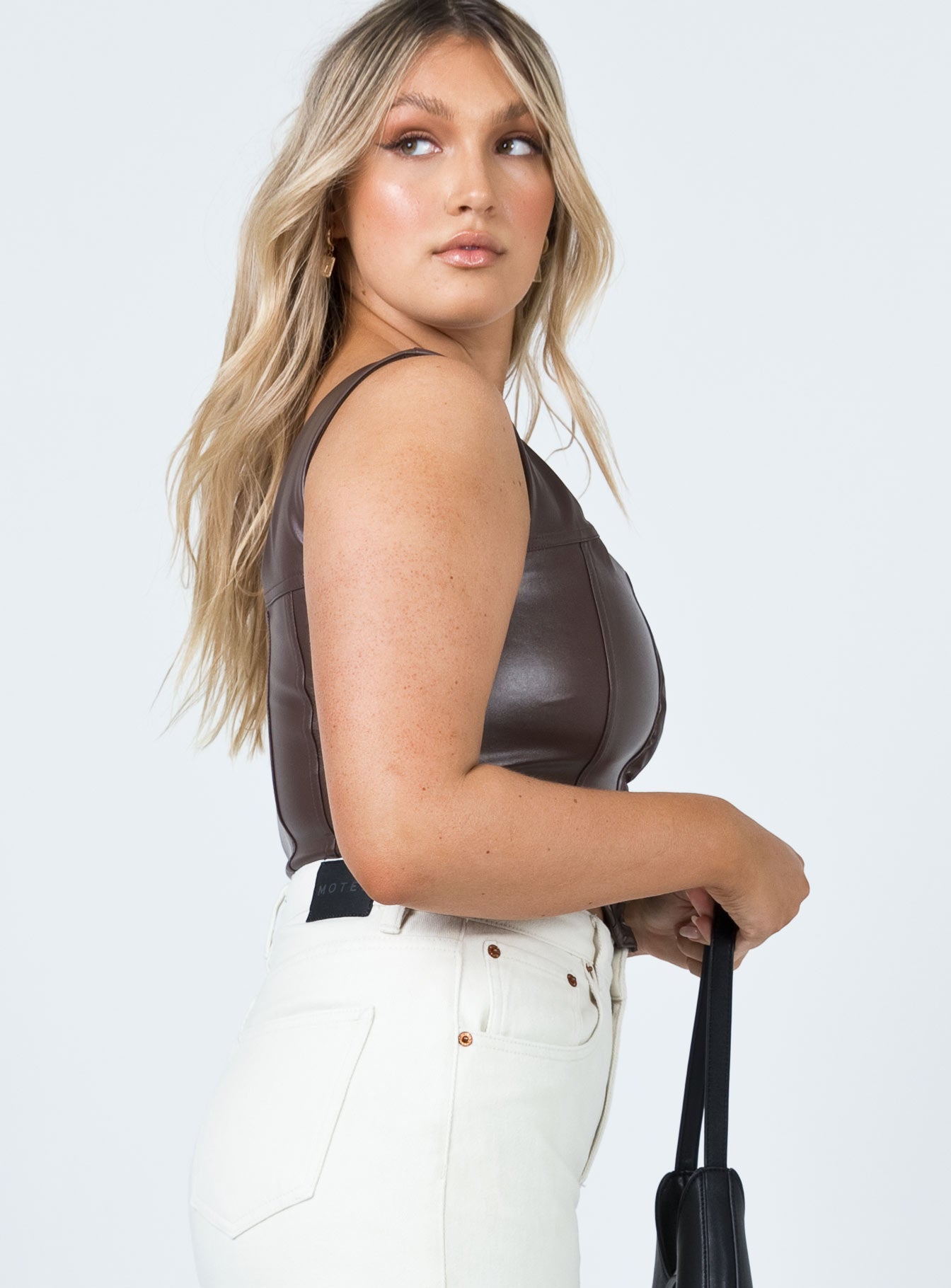 side view of model wearing Princess Polly Tatum Top Brown 