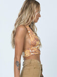 side view of model wearing Princess Polly Retro Floral Halter Top Orange 