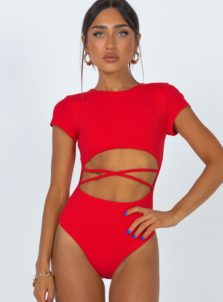 side view of model wearing Princess Polly Nicola Bodysuit Red Short Sleeves 