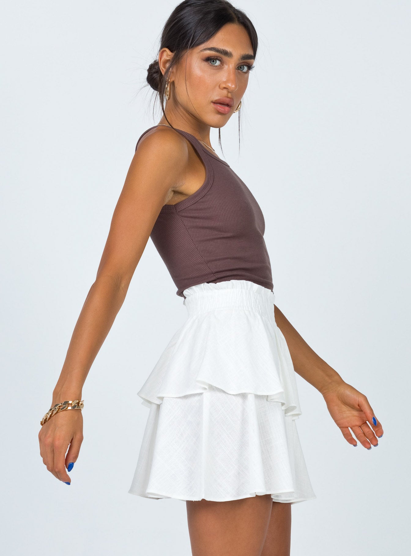   side view of model wearing Princess Polly Greta Mini Skirt Off White 