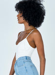 side view of model wearing Princess Polly Levey Bodysuit White Sleeveless Scoop Neck 