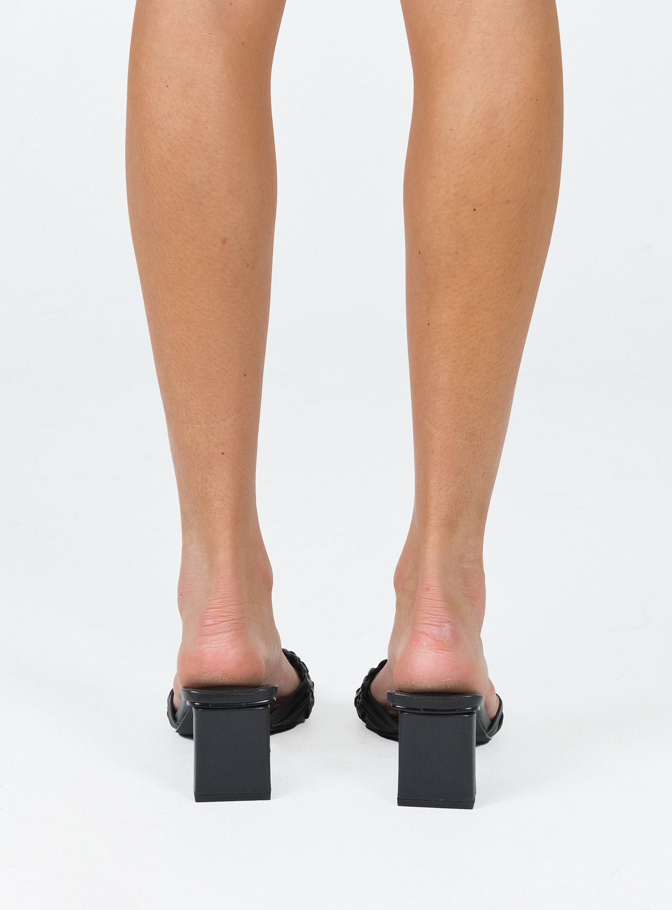 Black heels Faux leather material  Woven upper  Square toe  Shaved block heel  Padded footbed 